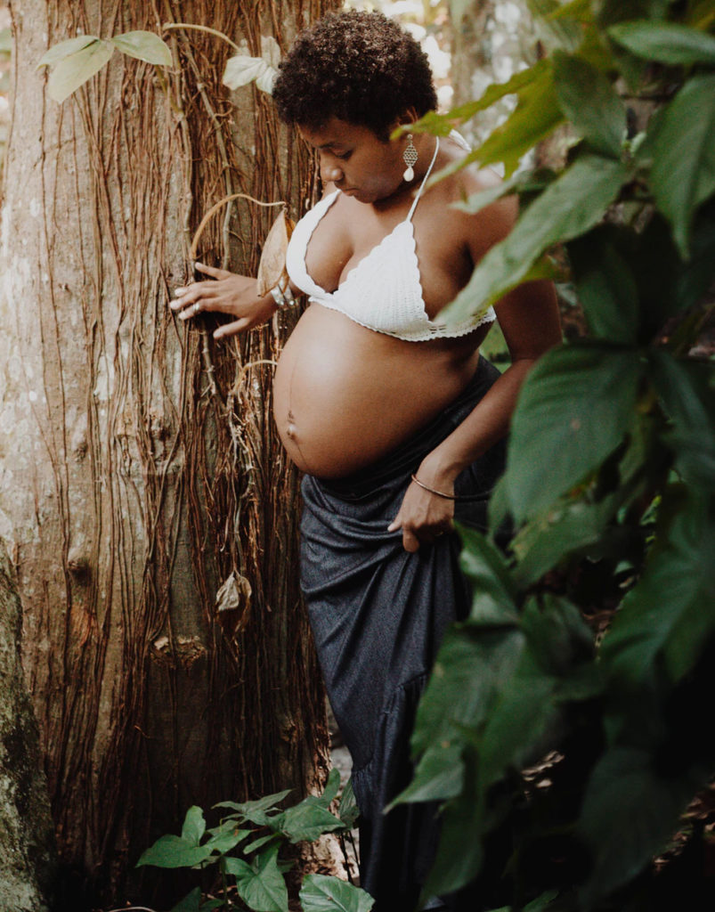 pregant woman near tree